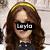 four pixelated images showing a woman with long brown hair wearing sunglasses and a yellow headband, with text overlays reading "Layla" and "Scamp Girl."