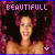 A 2x2 contact sheet of four animated frames showing a smiling woman with voluminous dark hair against a pink floral background, each frame featuring the text "BEAUTIFULL" at top and a heart symbol at bottom right.