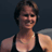 Pixelated static image of a person in athletic attire with dark hair and a neutral expression against a solid background.