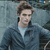 Pixelated static image of a person with brown hair wearing dark blue clothing and light blue collar against blurred background.