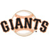 Pixelated image of the word 'GIANTS' in bold dark letters with a light brown circular shape behind it on white background.