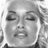 Static grayscale buddy icon of a person's face with closed eyes and slightly open mouth, rendered in low-resolution pixel art style on transparent background.
