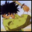 Pixelated anime character with spiky black hair in green shirt, holding brown object, next to black background with white text.