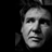Static grayscale pixelated image of a human face with visible dithering and anti-aliased edges on a black background.