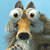 Pixelated dog face with large brown eyes, black nose, and light brown and gray fur against a solid light blue background.