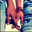 Two hands clasped together in a handshake pose, rendered with pixelated colors against a blue and white background.