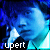 A 3x2 contact sheet of six animated frames showing a person's face with blue tinted pixels and the text "rupert" at the bottom of each frame.