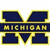 A static image featuring a large blue and yellow 'M' logo with 'MICHIGAN' text, alongside yellow-backgrounded blue text reading 'THE BIG HOUSE HOME OF THE MICHIGAN WOLVERINES', and an aerial view of a stadium.