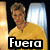 Pixelated image of a person with light brown hair wearing a yellow shirt, standing in front of a bright window with a warm-toned wall on the left.