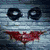 A static image of a character with white face paint, black eye makeup, and a red smile, with a red 'HK' symbol on the forehead.