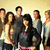 Group of people in a pixelated image with text overlays changing between frames.