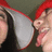Two figures in red headwear and dark clothing face each other with open mouths, positioned against a muted green background.