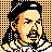 Pixelated 48x48 static buddy icon depicting a historical figure with black hair, mustache, and beard against an orange-and-black checkered background.