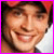 A four- with a pixelated image of a smiling person in the top-left, pink text reading "i love" in the top-right, and "Tom" in the bottom-left