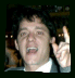 A person in a gray suit and white shirt appears across three showing facial expressions from open mouth to closed eyes