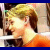Pixelated image of a person with light brown hair wearing an orange top, positioned on the left side of a blue background with red text elements.
