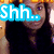 six pixelated images showing a person with long dark hair in a black top, with overlaid text and symbols changing across frames