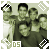 Pixelated group portrait of five people in military-style uniforms with dark hair, framed by a light green border with white and black checkered patterns.
