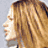 Four-frame contact sheet of a woman with long brown hair in various poses and angles, including profile view, sunglasses-wearing close-up, front-facing expression, and website text overlay.
