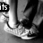 Black-and-white animation of a person's lower legs and feet in sneakers, with text changing across frames.