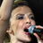 Static 48x48 pixel icon showing a close-up of a person singing into a microphone with visible facial features and partial hair, rendered in low-resolution pixel art style.