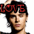 A pixelated image of a person with dark hair and red text overlays reading LOVE, ZAC, FEAR on different sections.