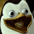 Pixelated cartoon penguin with wide eyes and open beak on black background, next to white text reading "I did it!!!".