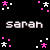 Pixelated text 'sarah' appears in gray and pink on a black background with scattered star-shaped pixels.