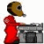 Animated figure in red hoodie and brown mask stands before gray stone fireplace, head turning from left to right.