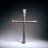 A wooden cross on a dark background with text reading "Jesus is my Savior" in black and yellow lettering.