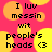 Pixelated text reads "I luv messin with people's heads <3" over a pink background with yellow and orange circles.