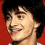 A red background displays three of a person with dark hair smiling, showing motion blur in the middle frame