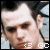 A pixelated close-up of a person's face with dark hair, showing two where the mouth shifts slightly downward