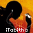 Pixelated image of a figure with black hair holding two microphones against an orange-yellow gradient background, with text reading 'iTobitho' at the bottom.