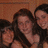 Group of people with long dark hair in a close pose against an orange background, showing slight variations across frames.