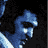 Pixelated blue cartoon character head with white highlights on a black background, appearing to be a static single-frame image.