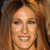 A pixelated close-up of a person with light brown hair, blue eyes, and a neutral expression, cropped to show the upper face and shoulders.