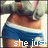 A pixelated image of a person in blue and white clothing with overlaid text reading "she just wants to fit in." A small pink heart appears below the text.