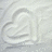 A static image with a white heart-shaped sand drawing on the left and green pixelated text reading "I LOVE KAYLIN SOOOO MUCH FOREVER AND ALWAYS" on black background.