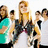 A pixelated group of people in teal and white shirts with orange text overlay, showing mirrored figures against a light background.