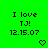 Green background with black pixelated text reading "I love TJ! 12.15.07" and two heart symbols, one on each side.