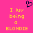 Pixelated pink background with yellow text reading "I luv being a BLONDIE" and a black heart outline above the text.