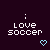 Pixelated text 'love soccer' with two colon symbols above, each followed by a light blue heart icon on dark purple background.