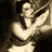 Static pixelated image of a person in motion with dark hair and light clothing against a dark background, rendered in sepia tones.