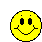 Yellow circular pixel art faces with red lips and black eyes or closed eyelids arranged in a on gray background