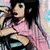 Anime-style character in pink top with black straps, dark hair, and light skin making a hand gesture near face.