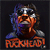Pixelated image of a character with brown skin, dark hair, and a blue garment, holding a silver object near the face, with orange text below.