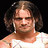 Pixelated static image of a person with long dark hair wearing a white sleeveless top against a black background.