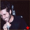 25 identical frames showing a person in a black shirt holding a microphone, with text overlays changing