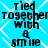 Pixelated text on a blue background with white diamond patterns, displaying 'Tied together with a smile' in black block letters.